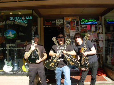 Team Holding Guitars